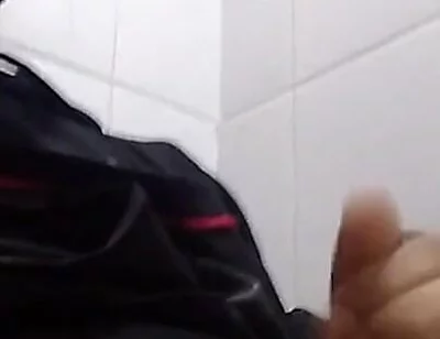 Man Sits in the Bathroom
