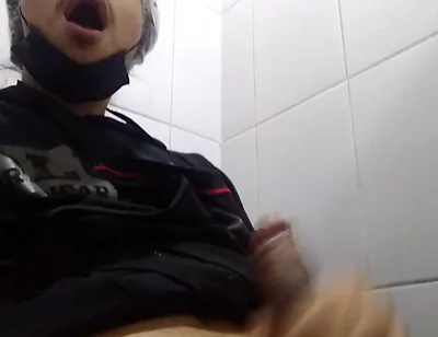 Man Sits in the Bathroom