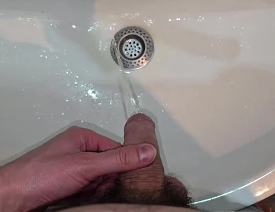 Hairy Cock Peeing Into the Sink in Bathroom with a Strong Stream