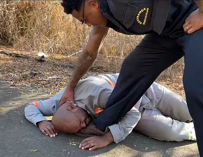 Vigilante Humiliating the Worker