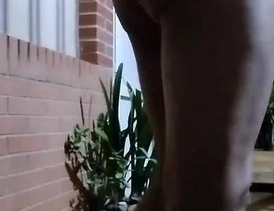 In the Doorway in a Thong and with an Anal Plug