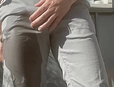 Jules Wets His Grey Pants and Exposes His Semi-hard Cock Through His Trousers