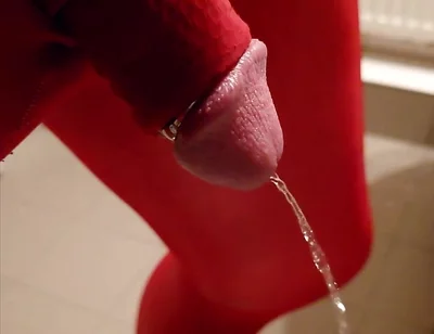 Pissing at Home in Red Legging with Penis Sleeve