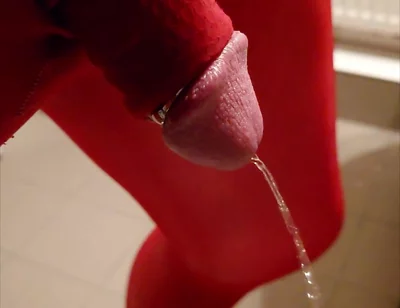 Pissing at Home in Red Legging with Penis Sleeve
