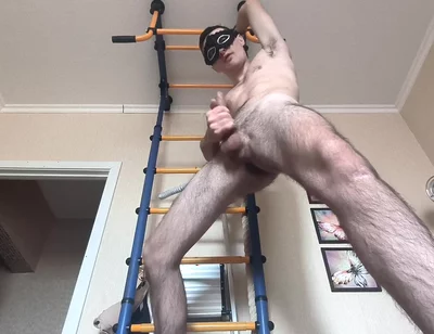 Cock Shaking While Hanging on the Horizontal Bar