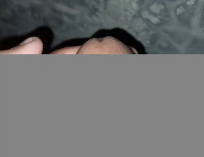 The Gay Boy Went to the Toilet, Turned on the Flash Light on His Mobile Phone, and Started Licking His Private Parts with Spit.