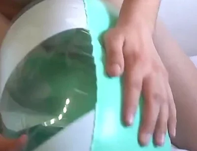 Playing with a Green and White Swimring