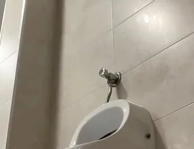 Amateur Twink Boy and Older Guy Caught Having Risky Fun in the Pool's Public Toilets