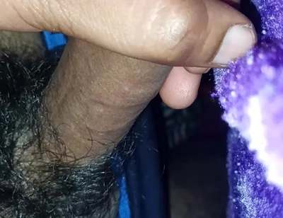 A Indian Young Boy Is Playing with His Penis Inside a Blanket