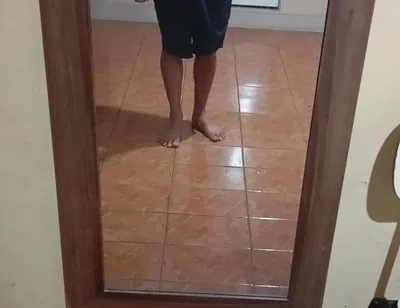 Boy in Shorts in the Mirror