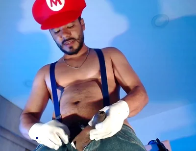 Dressed as Mario Bros Playing with His Plumbing Tool