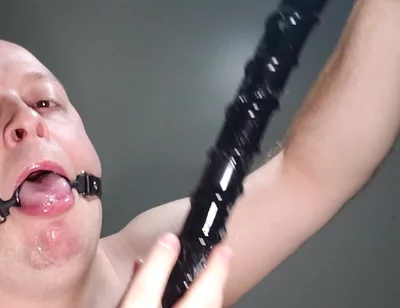 Deepthroating an 18 Inch Dildo with Mouth Gag Ring