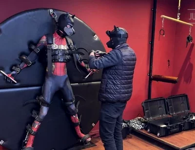 Pup Twink Dressed as Spider-man Strapped to the Bondage Wheel and Milked