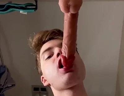 Cock Hungry Twink Slobbers on Giant Dildo!