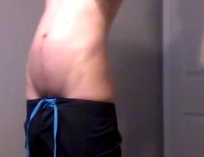 Young Guy Fills His Stomach with Water
