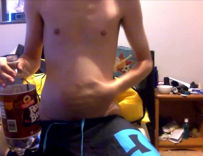 Young Guy Fills His Stomach with Water