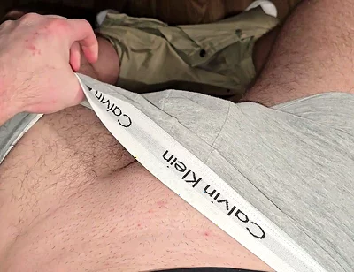German masked guy rubs huge bulge.. grey Calvins down.. cock dripping heavy