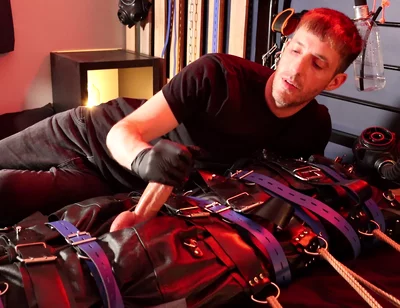 Edging the Boy in Leather Bondage but He Is Not Allowed to Orgasm