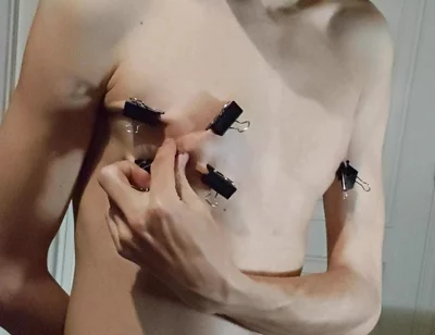 Twink Playing with Binder Clips