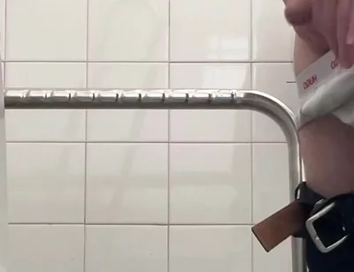 In the Hospital Toilets, a Guy Pisses Into a Cup for a Urine Sample, Then Gets Horny, Jerks-off and Cums