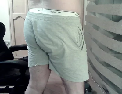 Muscular Camboy Flexes His Muscles and Squats
