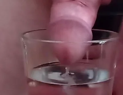 Cumming in a glass of hot water