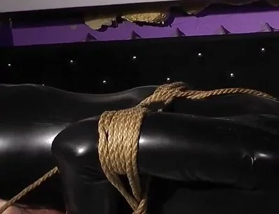 Roped in Latex: Zeus Struggles to Break Free
