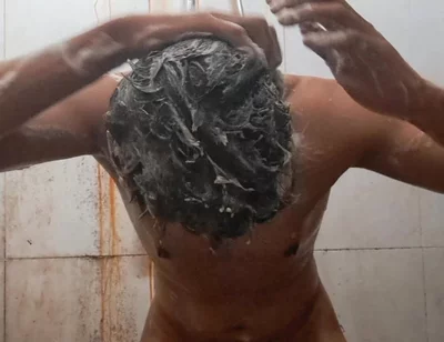 Exotic Skinned Adult Man Taking a Bath in the Afternoon