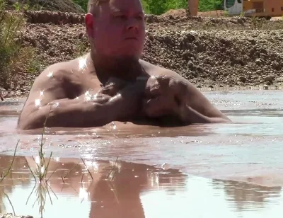 Deep, Creamy Brown Mud Bath in a Sand Pit