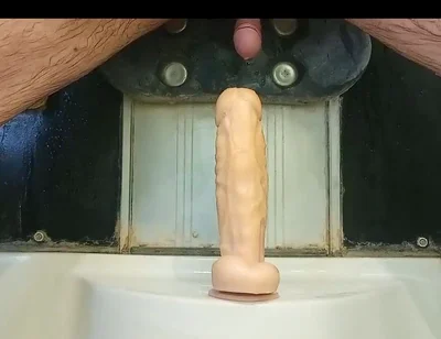 Mulatto Jumps on a Dildo and Pisses