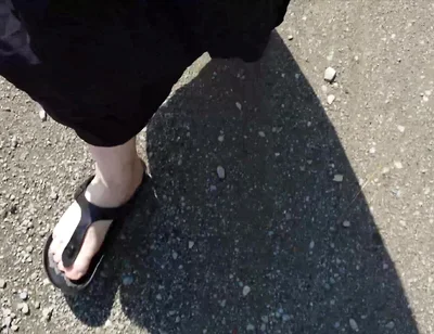 Outdoor in a Black Caftan and Barefoot in Black Birkenstocks