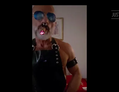 Stepdad lighting his Cigar in rubber apron