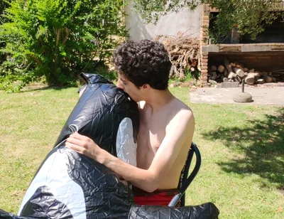 Beautiful Man Inflates His Inflatable Whale Near Pool Outside