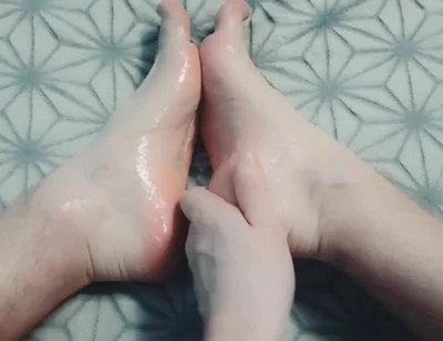 Guy Gently Massages His Feet with Oil